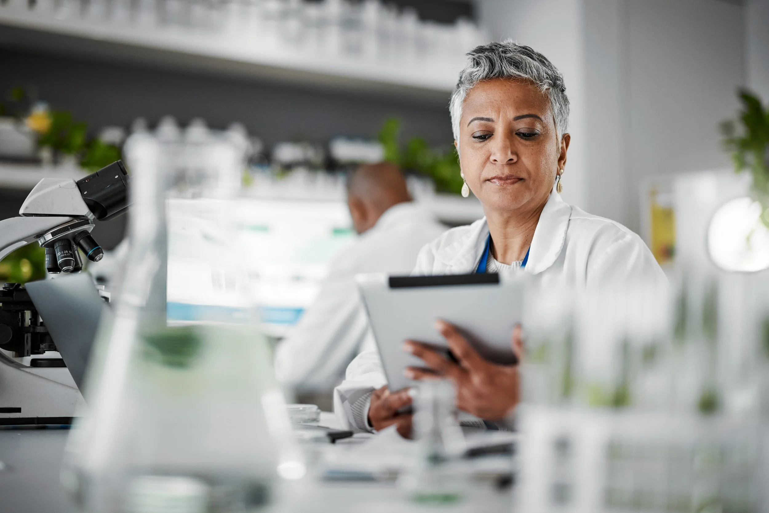 Research coordinator reviewing a protocol on a tablet